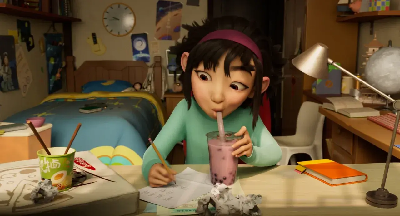 Dziewczynka pije bubble tea, pisząc wypracowanie. Może to jedna z bajek na Netflixie, która inspiruje do nauki i marzeń.